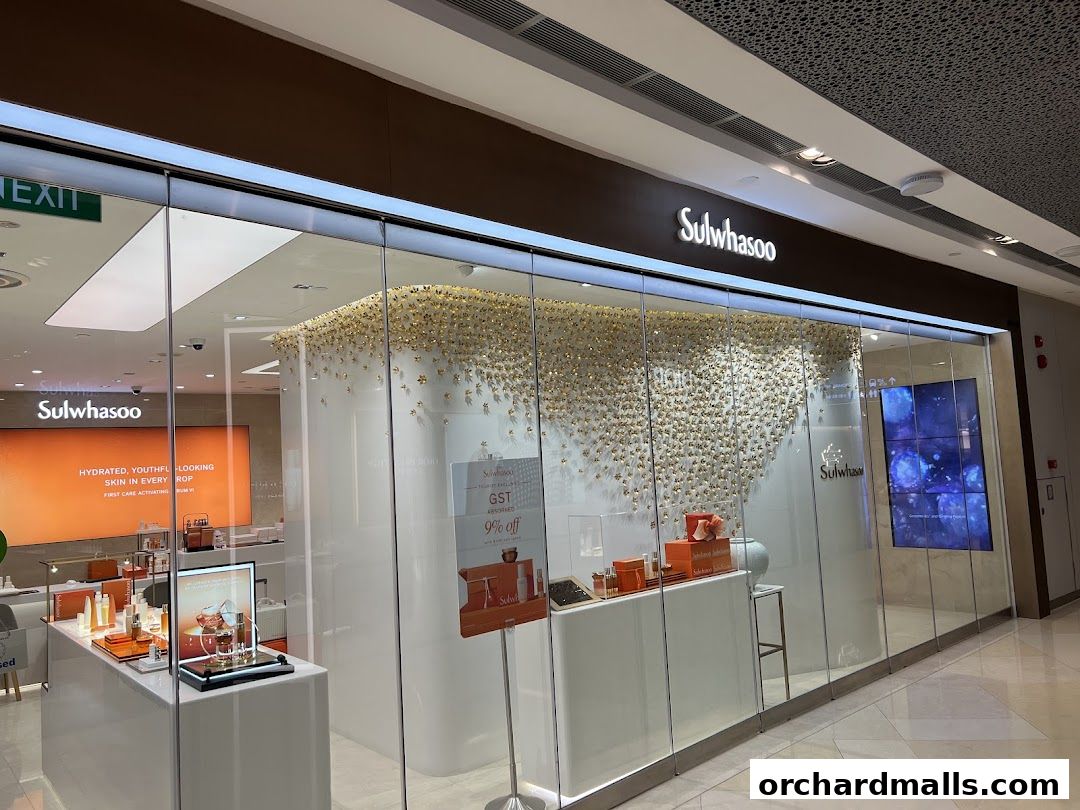 The Sulwhasoo Boutique at ION Orchard features a modern storefront with elegant product displays and a striking floral art installation.
