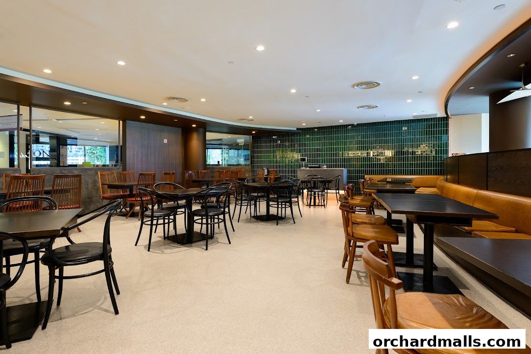 Interior view of SUN with MOON Japanese Dining Cafe, showcasing dining tables and seating.