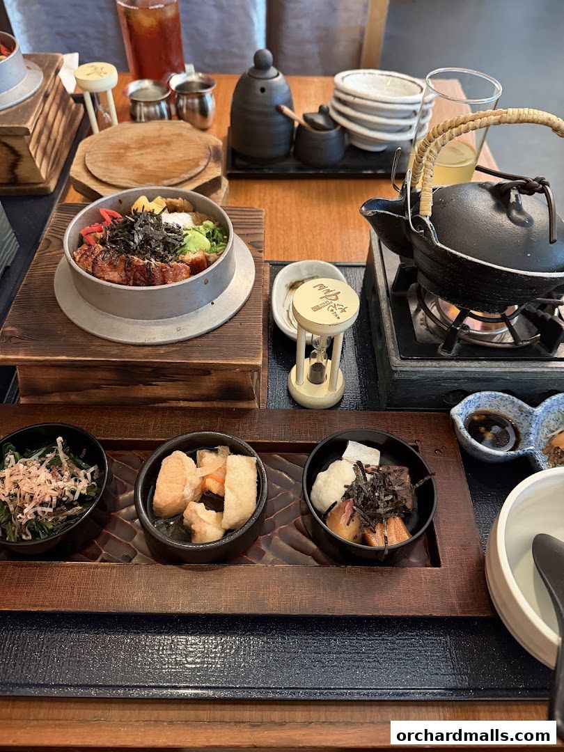 A beautifully presented Japanese meal with various small dishes and a hot pot.