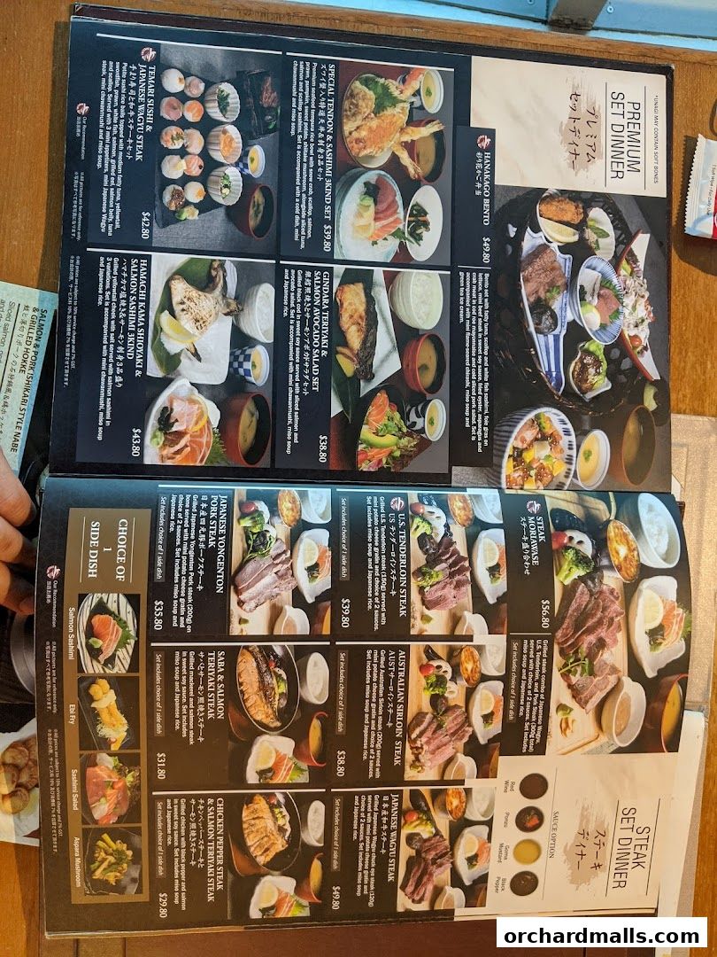 A menu from SUN with MOON Japanese Dining Cafe featuring various set dinners and steak options.