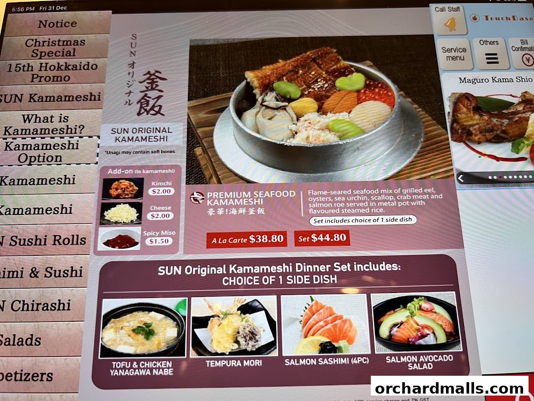 A digital menu displays Japanese dishes, including Kamameshi and sushi options.