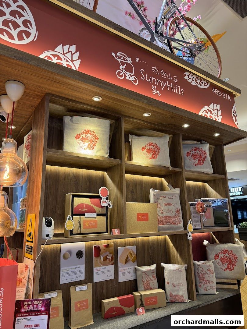 A display of gift boxes and bags with dragon motifs at SunnyHills Orchard.