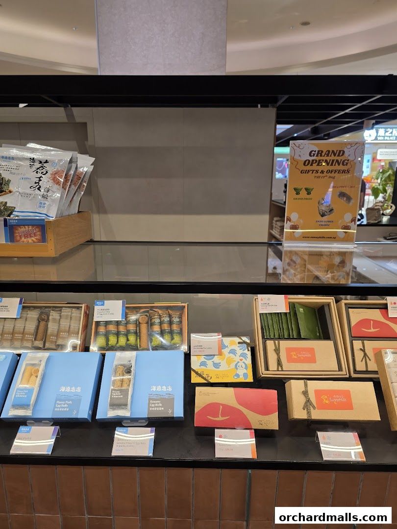 A display of gift boxes and packaged snacks from SunnyHills Orchard.
