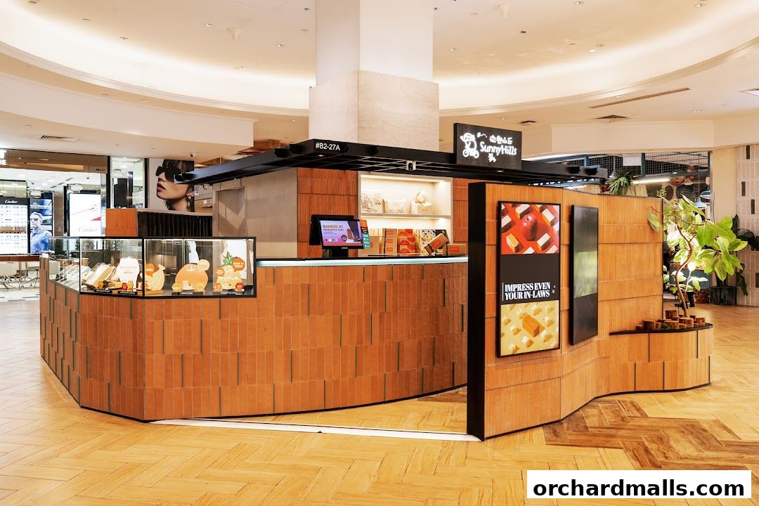 SunnyHills Orchard shop front with display cases and promotional posters.
