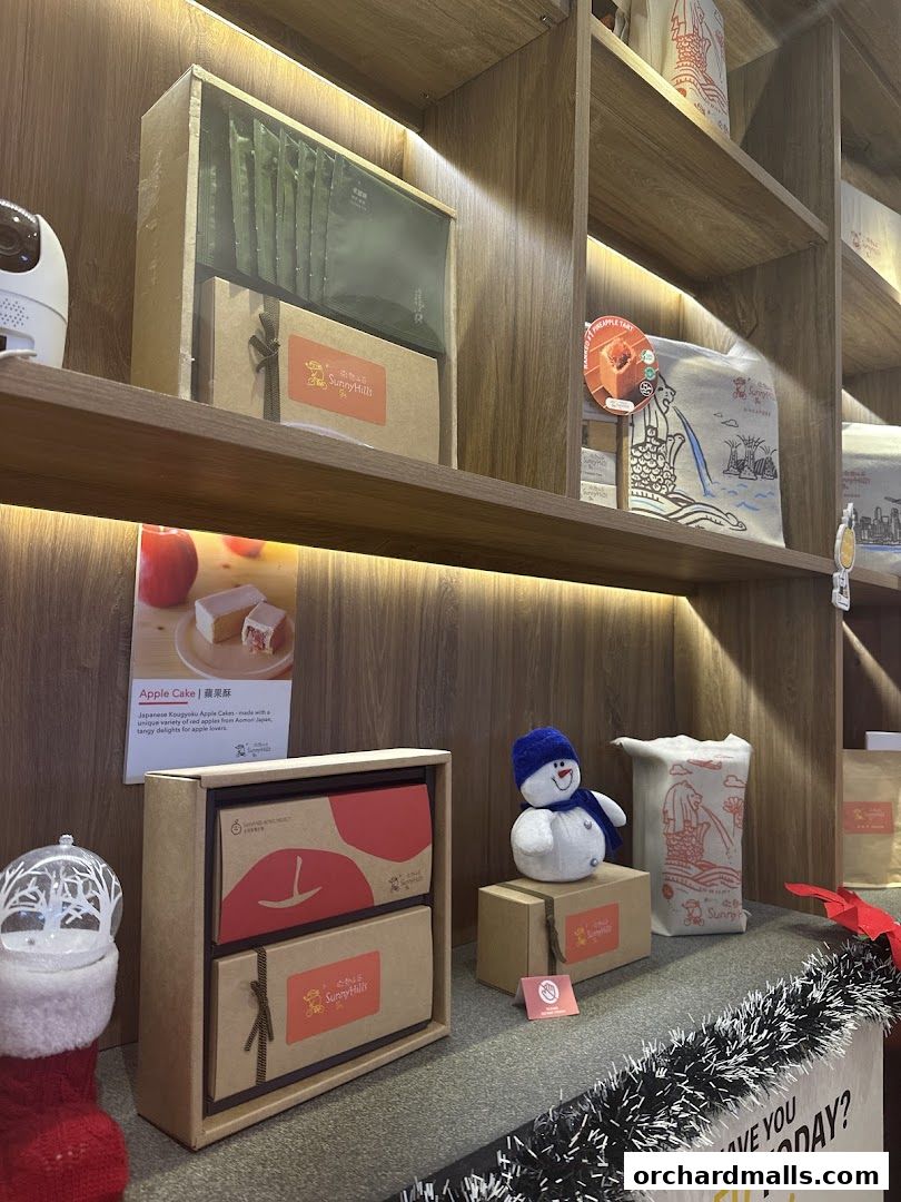 Shelves display gift boxes, packaged treats, and festive decorations from SunnyHills Orchard.