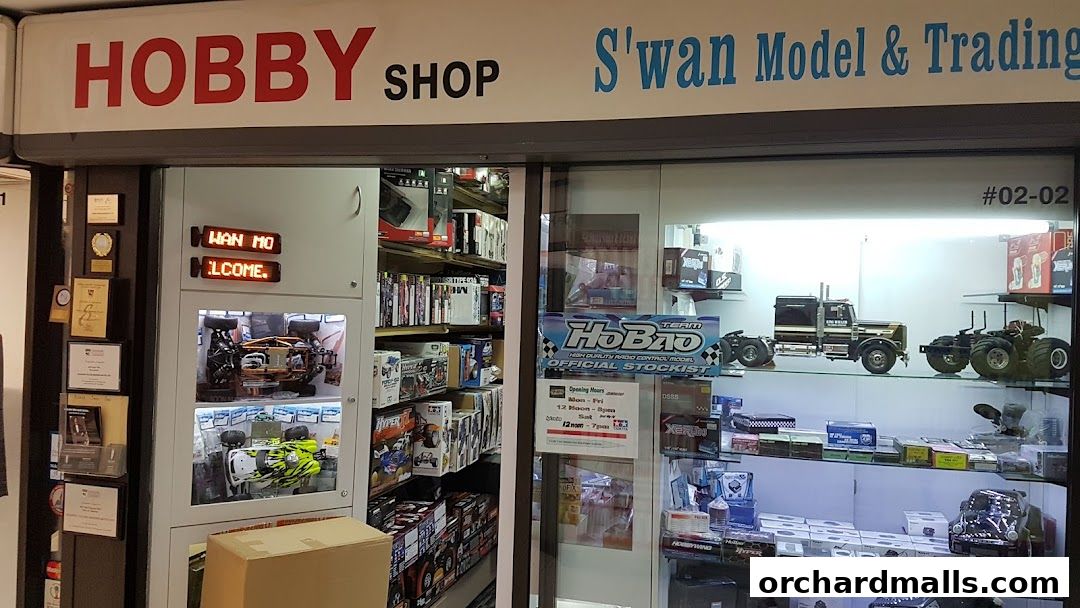 Exterior of a hobby shop displaying model cars, trucks, and related accessories.