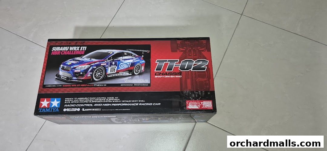A Tamiya radio control model kit of a Subaru WRX STI NBR Challenge car.