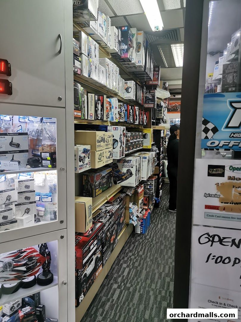 Interior view of a retail shop selling model cars and related accessories.