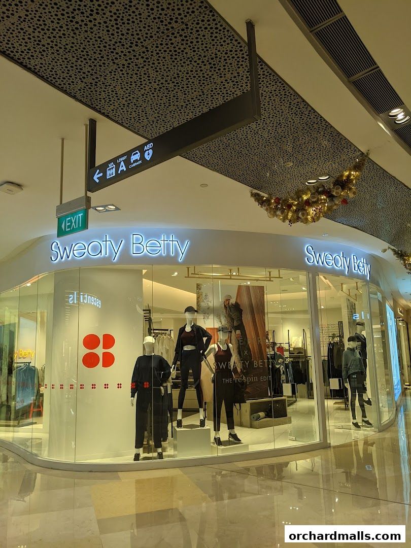The Sweaty Betty store features mannequins in activewear displayed in a well-lit, modern shop front.