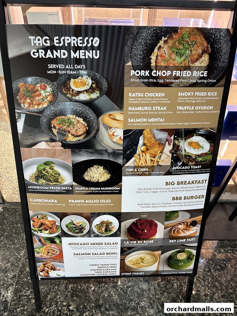 A large A-frame menu board displaying various food and dessert items from TAG Espresso.