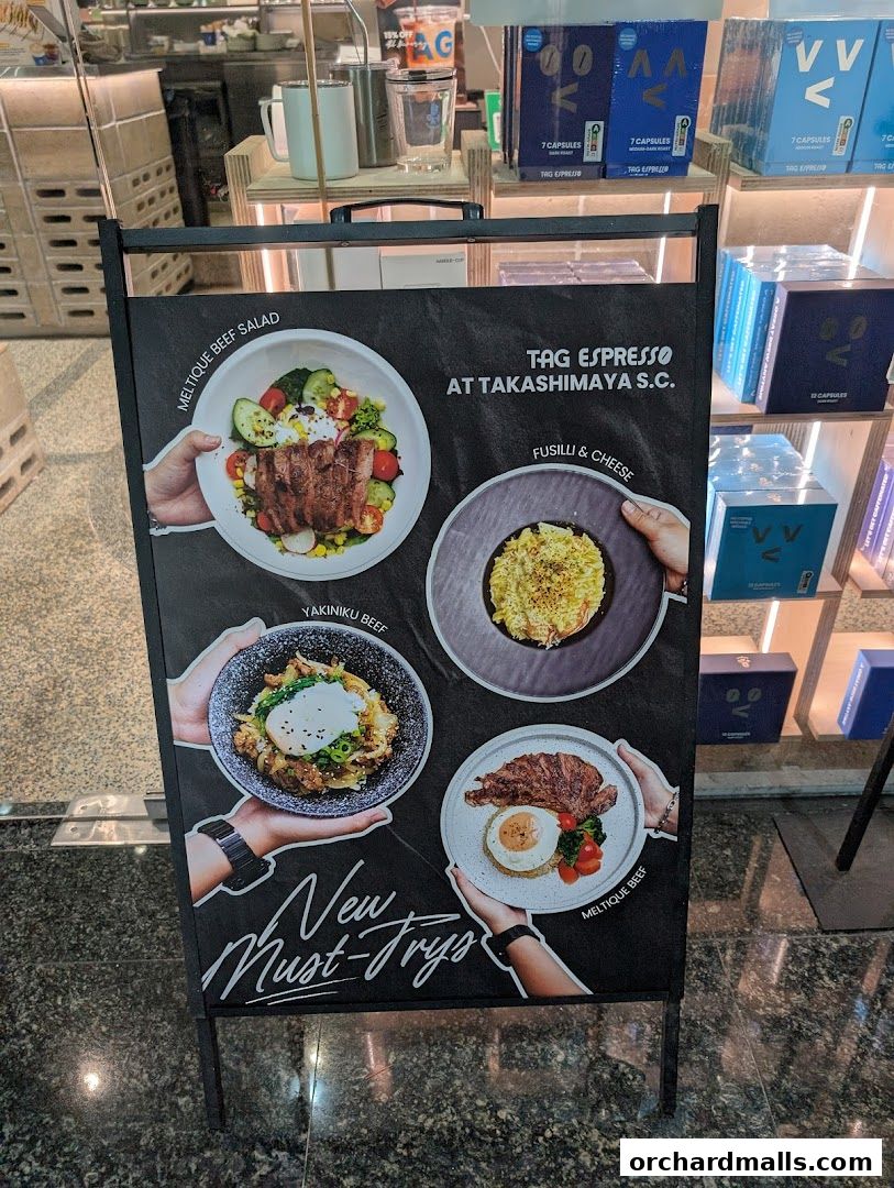 A-frame sign advertising new must-try dishes from TAG Espresso at Takashimaya S.C.