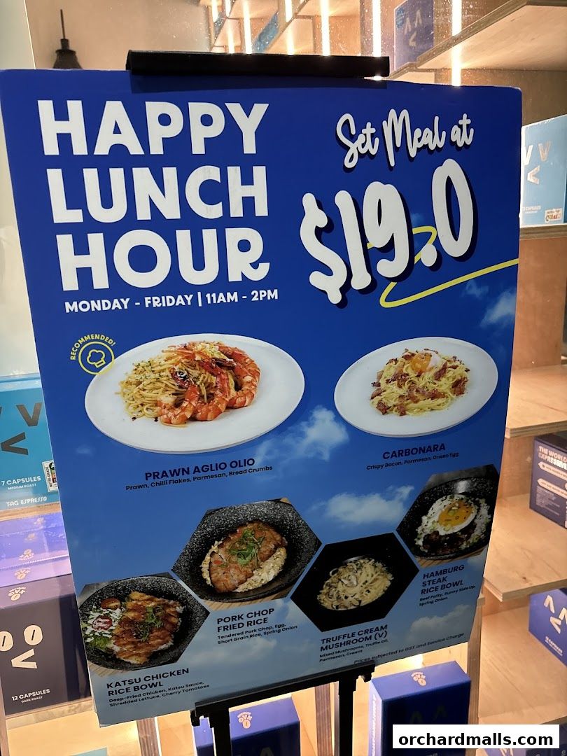 A sign advertising TAG Espresso's Happy Lunch Hour set meals.