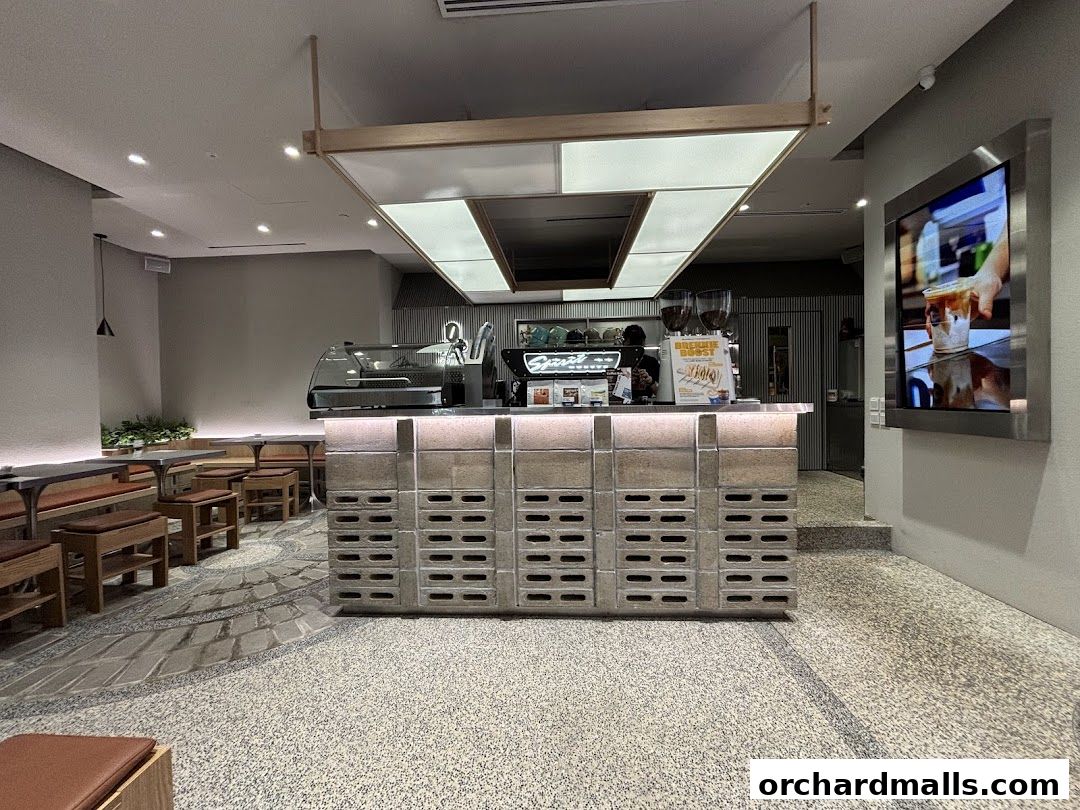 Interior of TAG Espresso coffee shop with a modern counter and seating area.