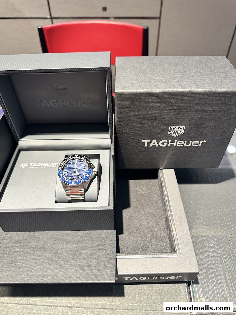 A TAG Heuer watch displayed in its branded packaging, ready for purchase.