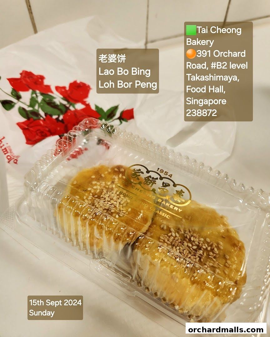 A close-up of Lao Bo Bing pastries from Tai Cheong Bakery in a clear plastic container.