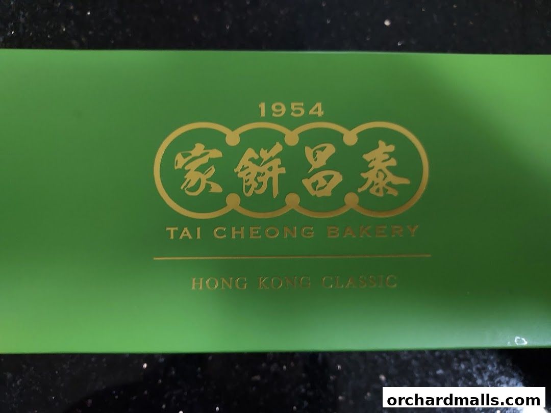 A green box with gold lettering from Tai Cheong Bakery, established in 1954.