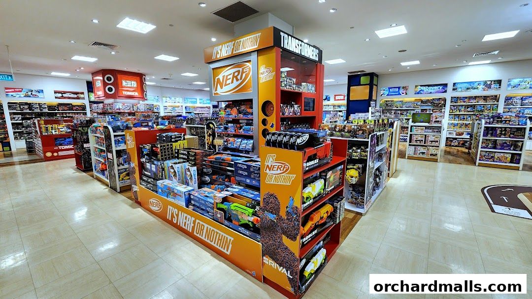Interior view of a well-stocked toy store with shelves full of various toys and branded displays.