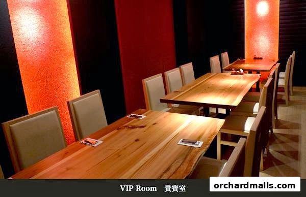 Interior of a VIP room at Tampopo Grand with wooden tables and chairs.