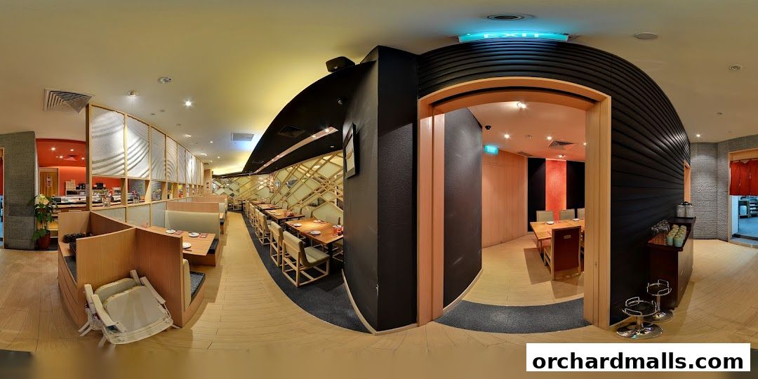 Interior view of Tampopo Grand restaurant with seating areas and dining tables.