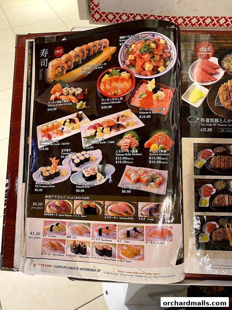A menu from Tampopo featuring various sushi dishes, sashimi, and rolls with prices.