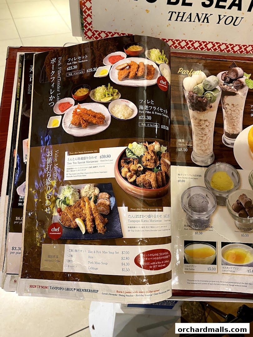 A menu from Tampopo restaurant featuring various Japanese dishes and desserts.
