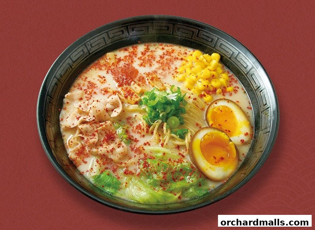 A delicious bowl of ramen with noodles, egg, corn, meat, and vegetables.