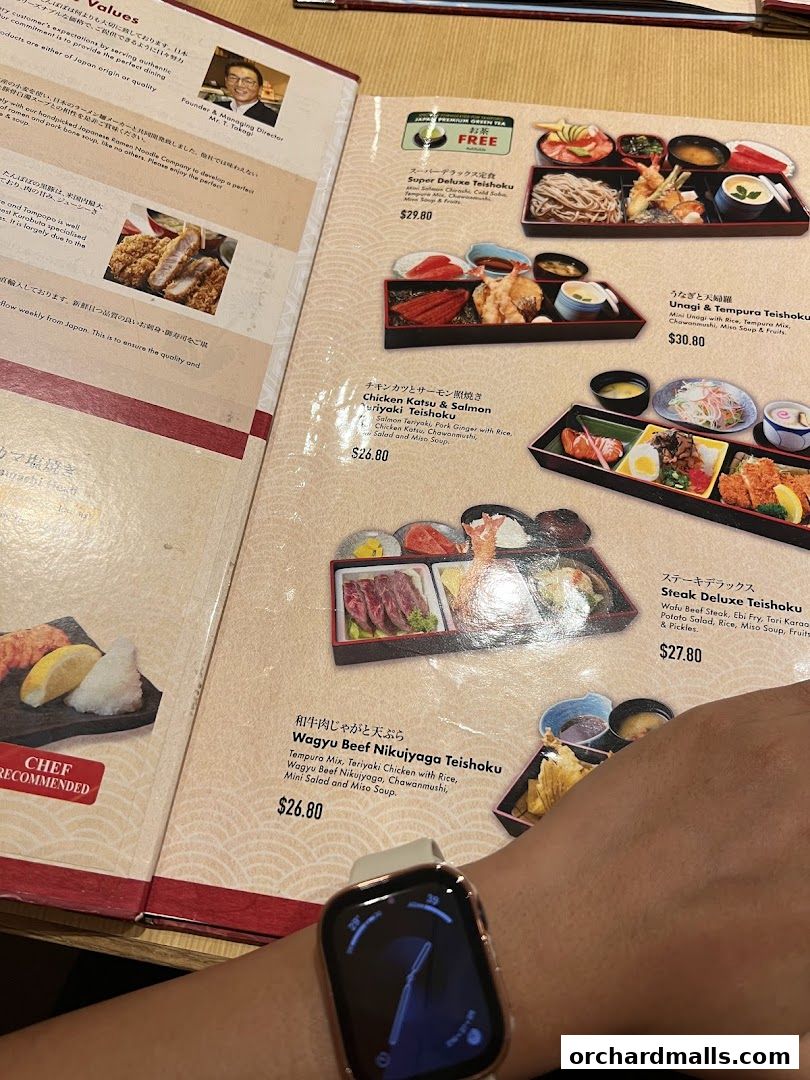 A close-up of a Japanese restaurant menu featuring various teishoku (set meals) with descriptions and prices.