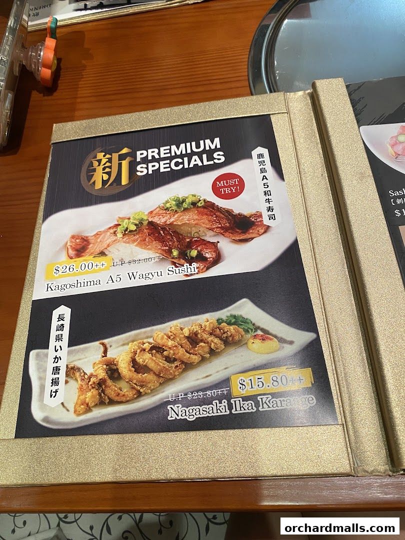 A menu page showcasing premium specials, including Wagyu sushi and fried squid.