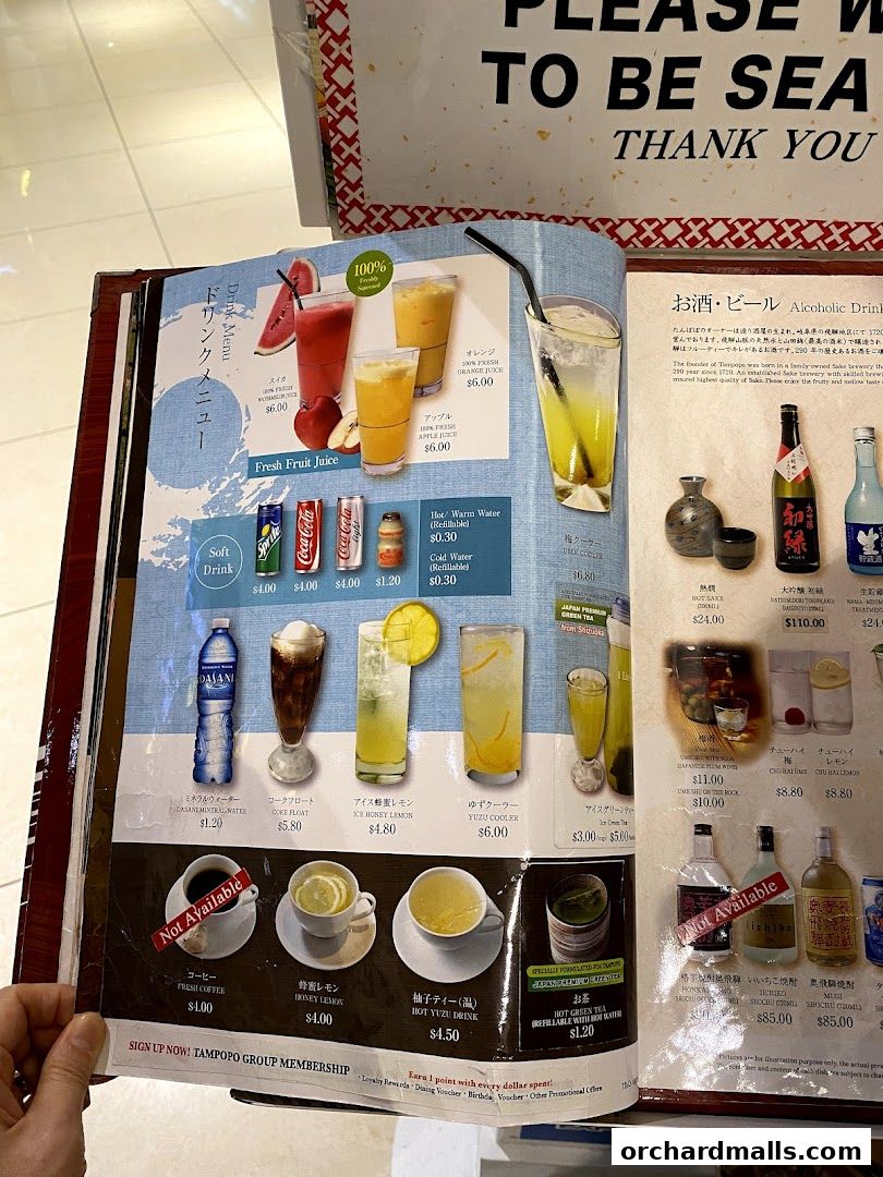 A menu from Tampopo featuring drinks like fresh fruit juices, soft drinks, coffee, and alcoholic beverages.