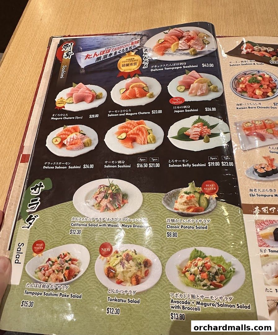 A menu from Tampopo restaurant featuring sashimi, salads, and other Japanese dishes.