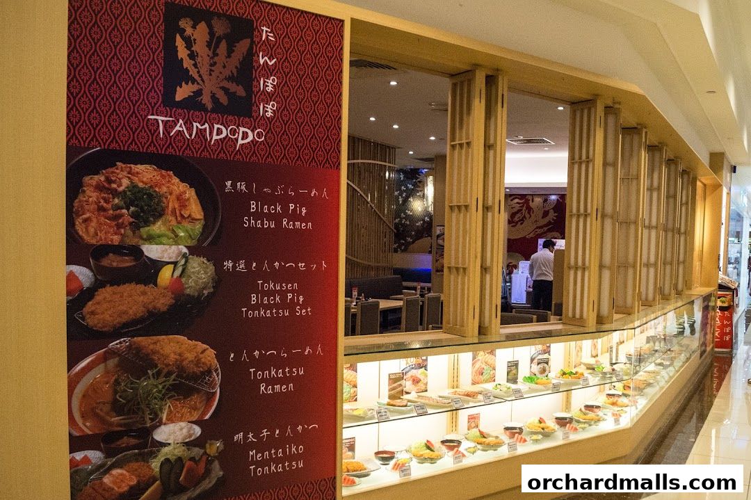 Tampopo Japanese restaurant storefront with a menu display and food models.