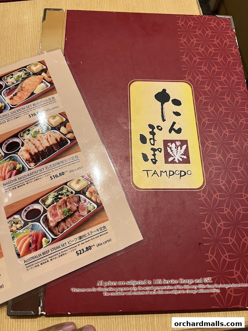 A menu from Tampopo restaurant featuring various Japanese set meals with prices.
