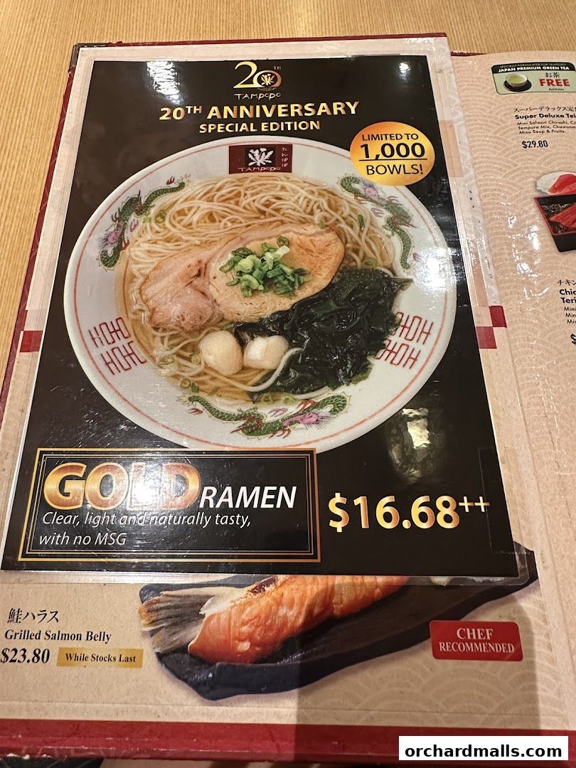A menu featuring Tampopo's 20th Anniversary Gold Ramen and Grilled Salmon Belly.