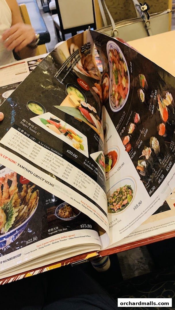 A close-up of a Japanese restaurant menu showcasing various sushi and donburi dishes with prices.