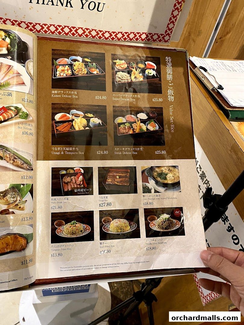 A menu from Tampopo restaurant showcasing various Japanese bento boxes and rice dishes.