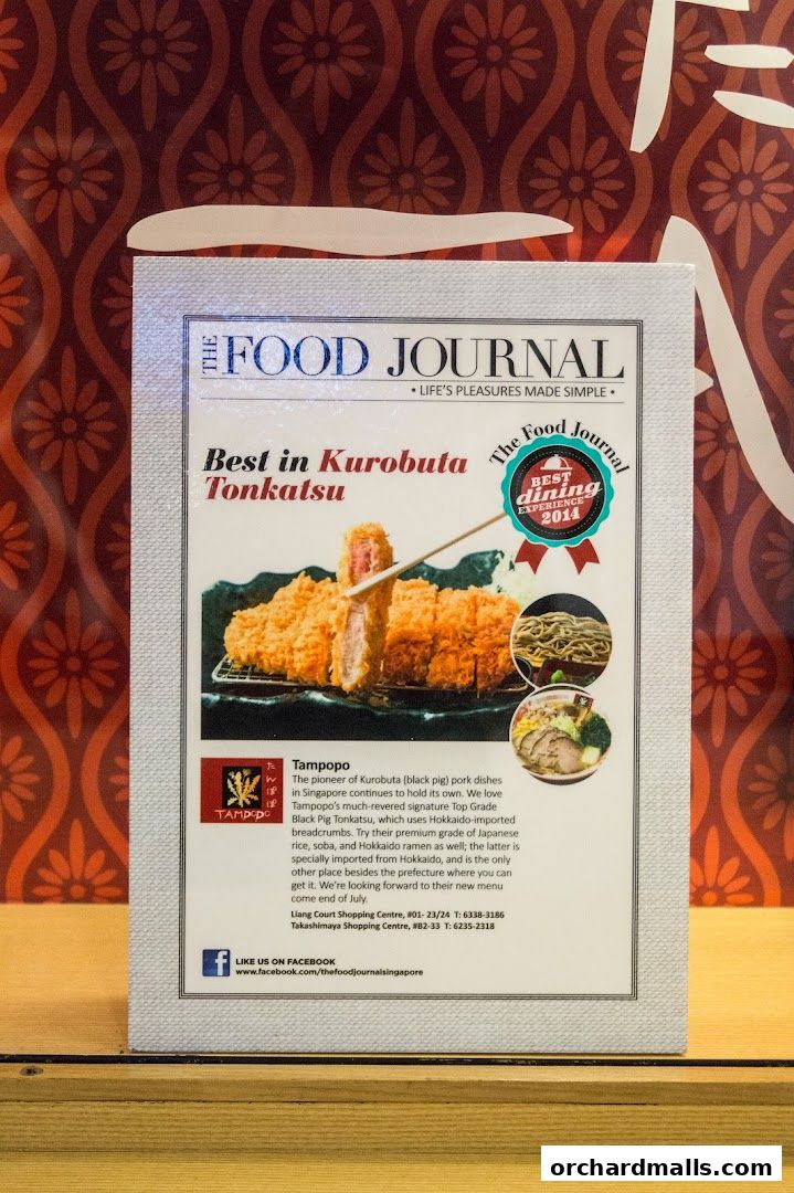 A magazine clipping featuring Tampopo's Kurobuta Tonkatsu and other dishes, with restaurant information.