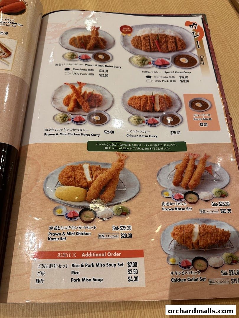A menu from Tampopo featuring various katsu curry and set meals with prices.