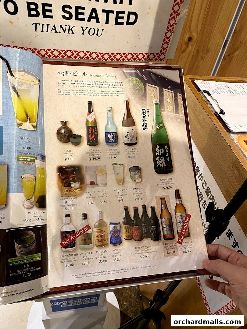 A menu page from Tampopo featuring alcoholic drinks like sake, shochu, and beer.