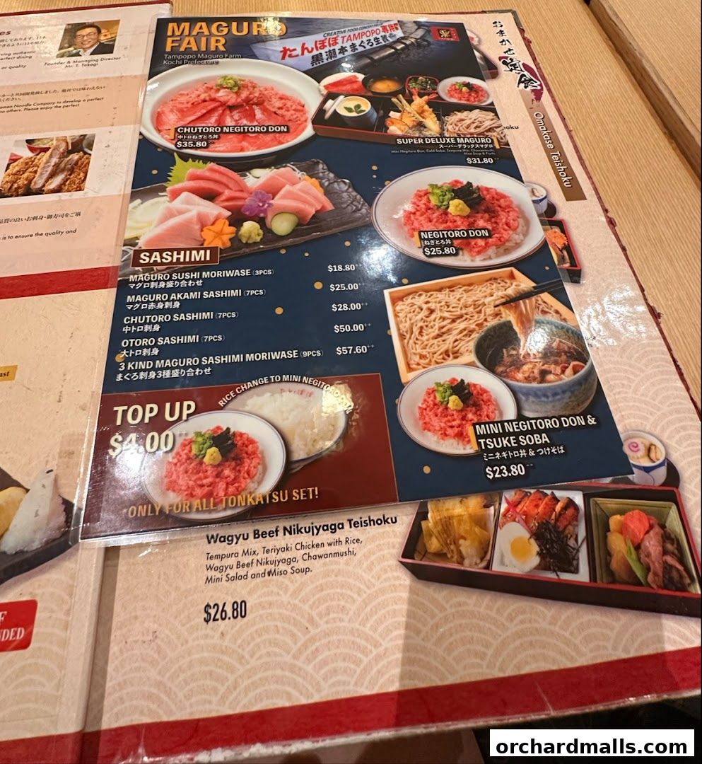 A menu from Tampopo featuring various tuna dishes, sashimi, and set meals.