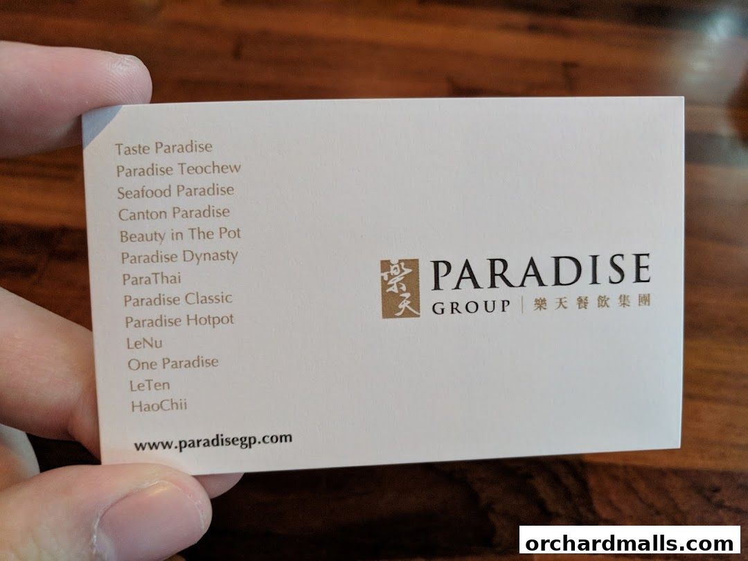 A business card for Paradise Group, listing various restaurant brands and their website.