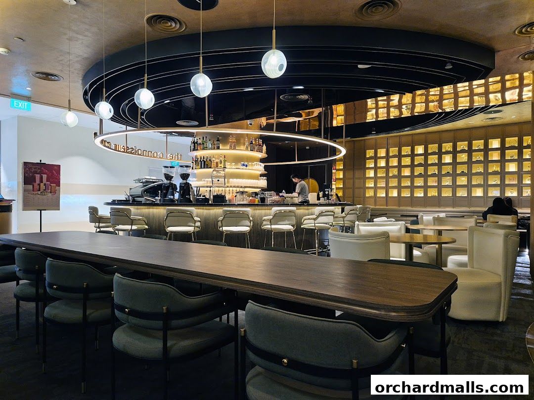 Interior of a stylish bar and lounge area with a prominent bar and seating.