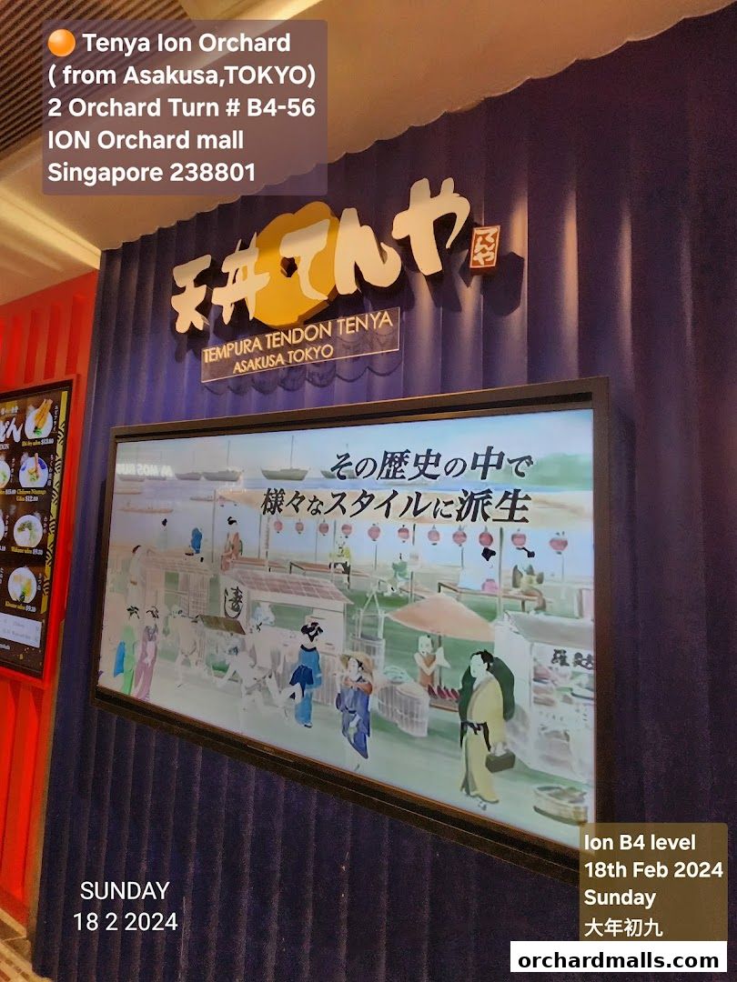 The exterior of Tenya Ion Orchard, a Japanese tempura restaurant, with its logo and a digital display.