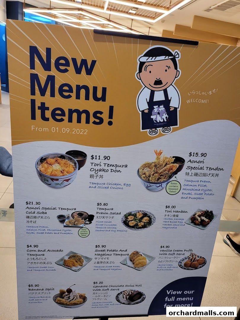 A menu board showcasing new Japanese tempura dishes and desserts.