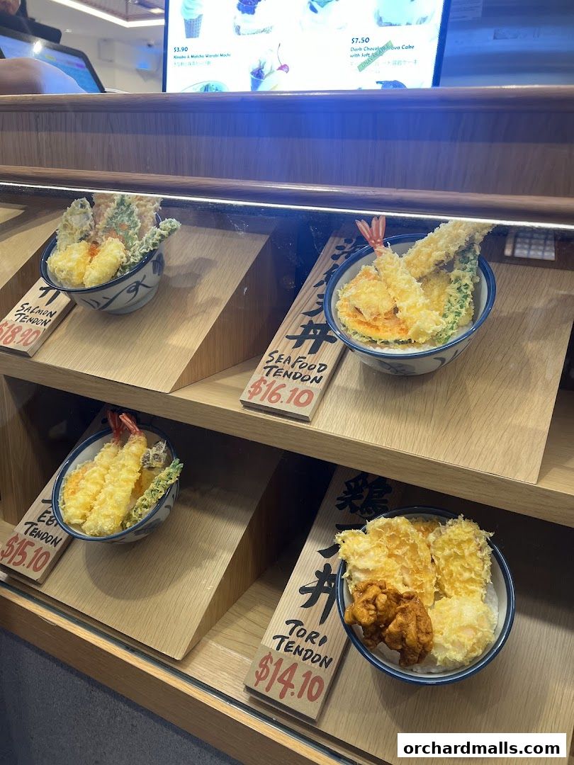 A display of various tendon bowls with prices and names.