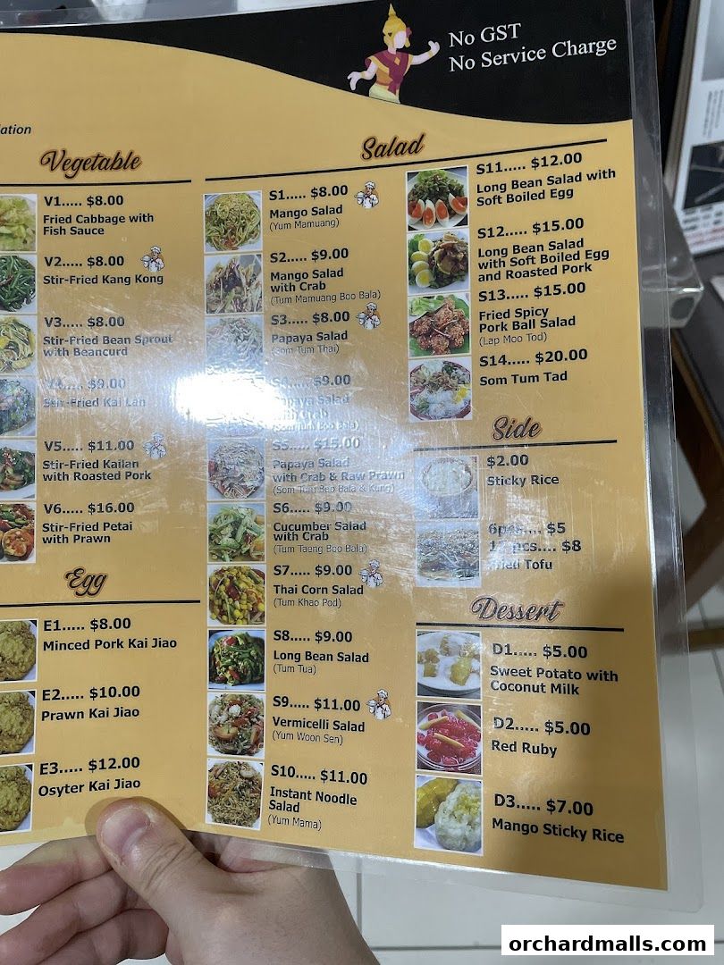 A menu for Tha Siam Thai Kitchen featuring vegetable dishes, salads, eggs, sides, and desserts.