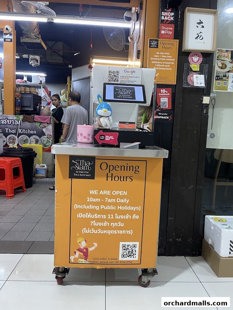 The exterior of Tha Siam Thai Kitchen showing their opening hours and contact information.