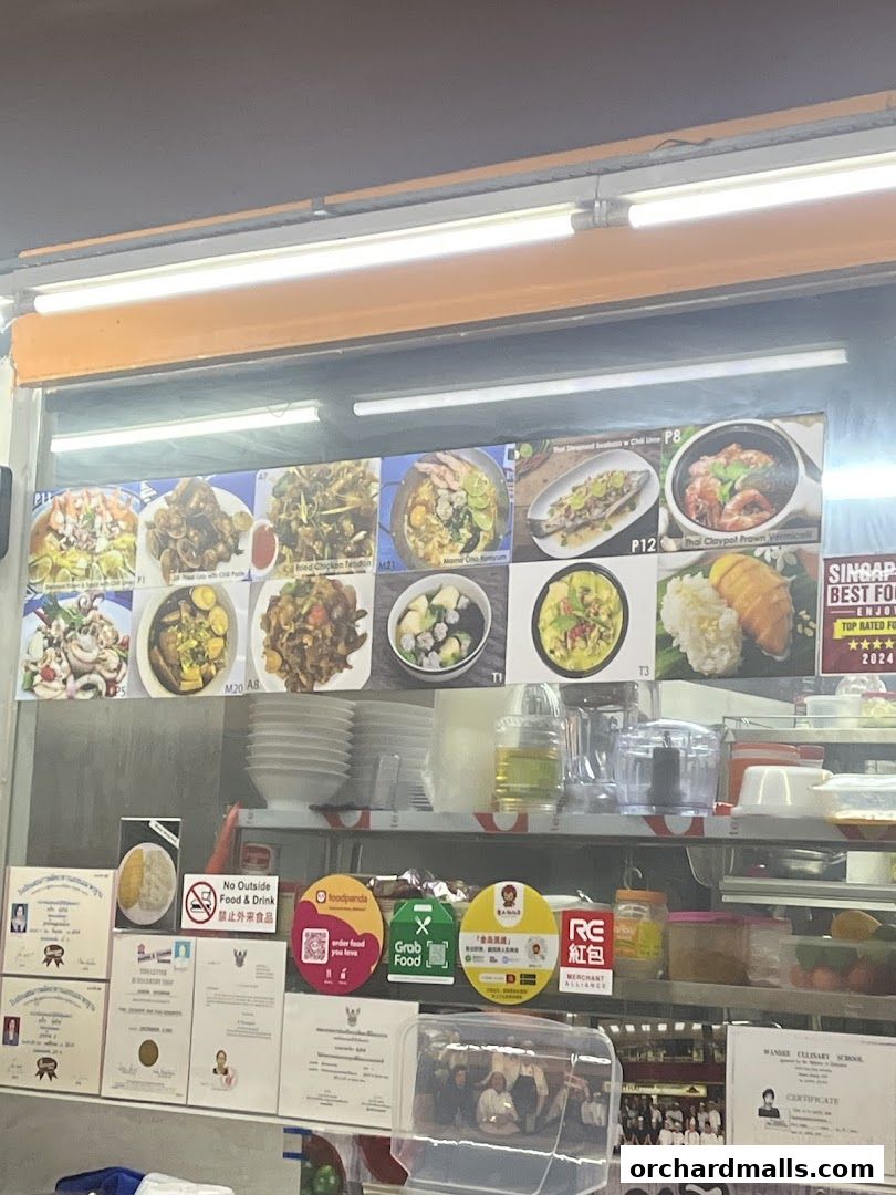 A display of Thai food dishes with prices and descriptions.
