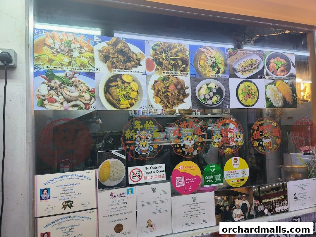A display of Thai food dishes with prices and delivery service logos.