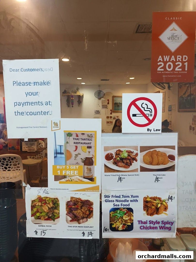 A display of Thai food items with prices and a 'Buy 5 Get 1 Free' offer.
