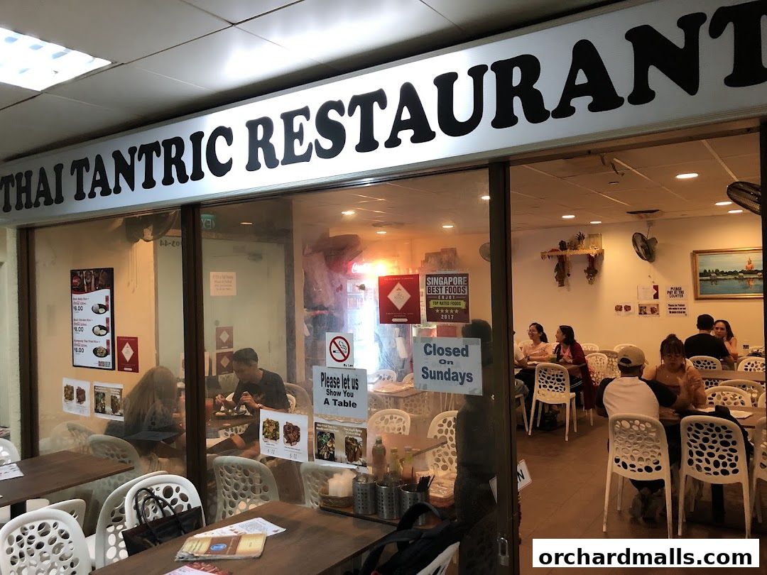 Exterior view of Thai Tantric Authentic Thai Cuisine restaurant with customers dining inside.